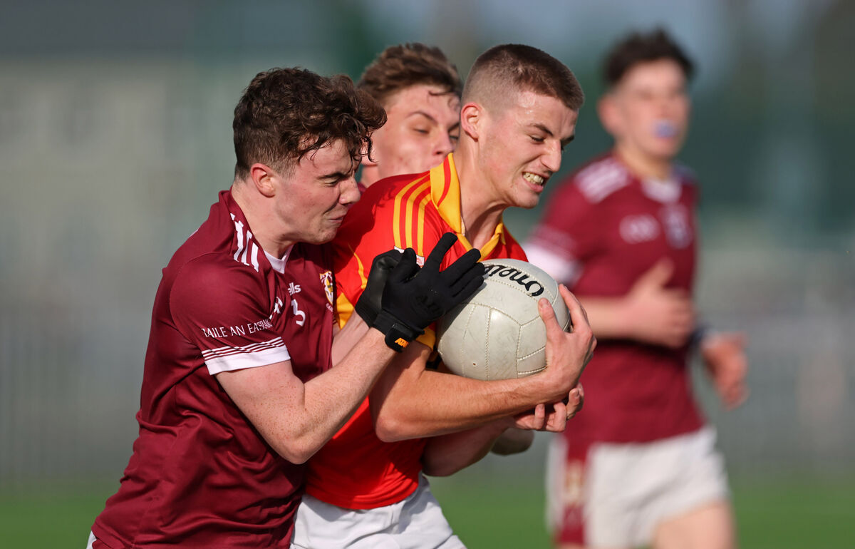  Charlie Vaughan and Gary Holland, Bishopstown, clash with Darragh Clifford, Eire Og.