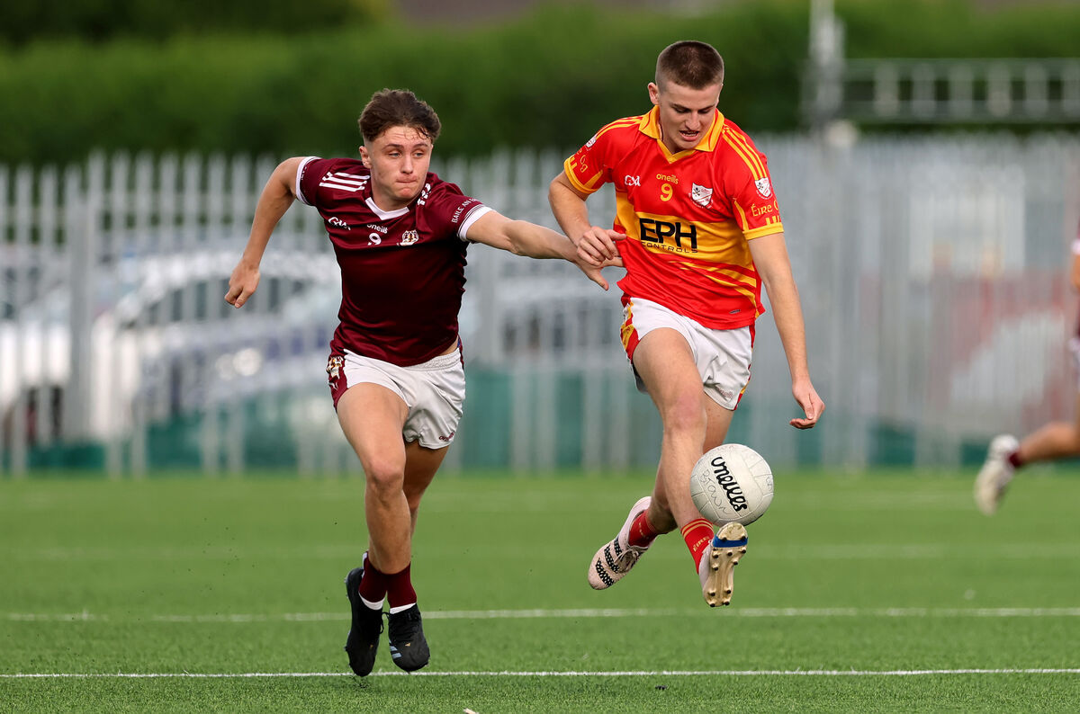  Gary Holland, Bishopstown, battles with Darragh Clifford, Eire Og.