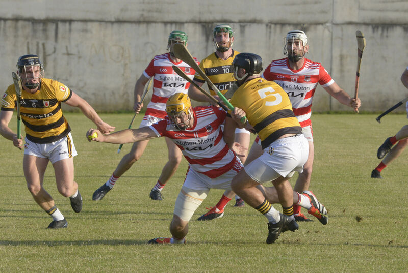 Courcey Rovers' Sean Twomey is tackled by Na Piarsaigh's Gordon Joyce in the Senior A Hurling Championship. Picture: Denis Boyle