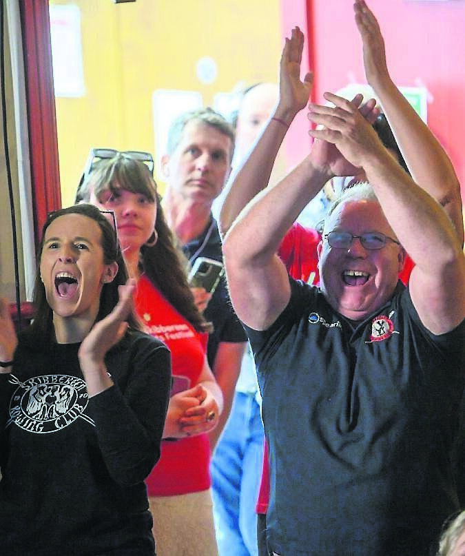 Denise Walsh and TJ Ryan watching Paul O’Donovan and Fintan McCarthy win gold in the lightweight men’s double sculls Olympic final at the Town Hall, Skibbereen, Cork. Picture Dan Linehan
