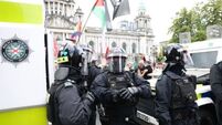 Violent clashes and businesses attacked amid anti-immigration protest in Belfast