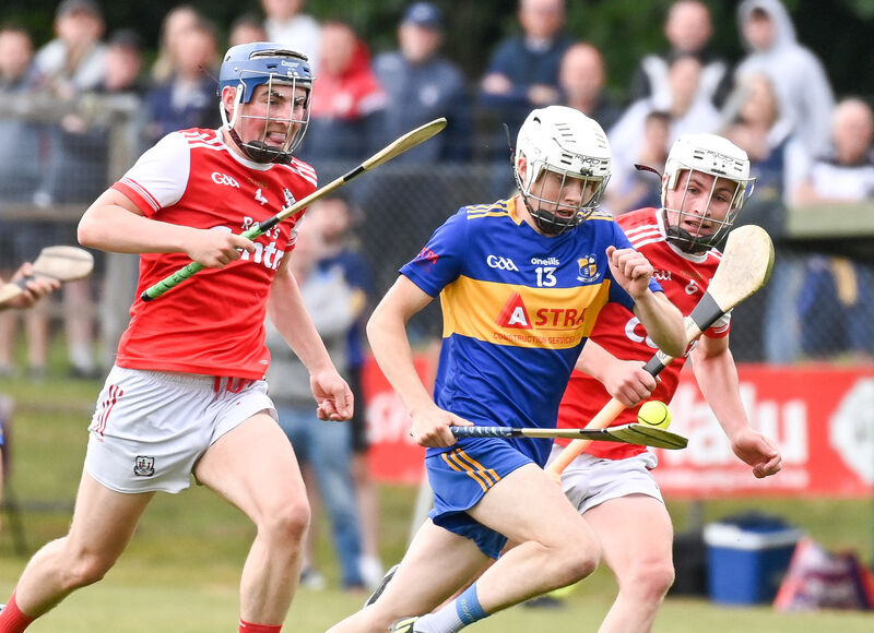 Carrigaline's Ciaran Kearney is chased down by Watergrasshill's Dylan Roche and Ian O'Callaghan. Picture: David Keane. Carrigaline's Ciaran Kearney is chased down by Watergrasshill's Dylan Roche and Ian O'Callaghan. Picture: David Keane.
