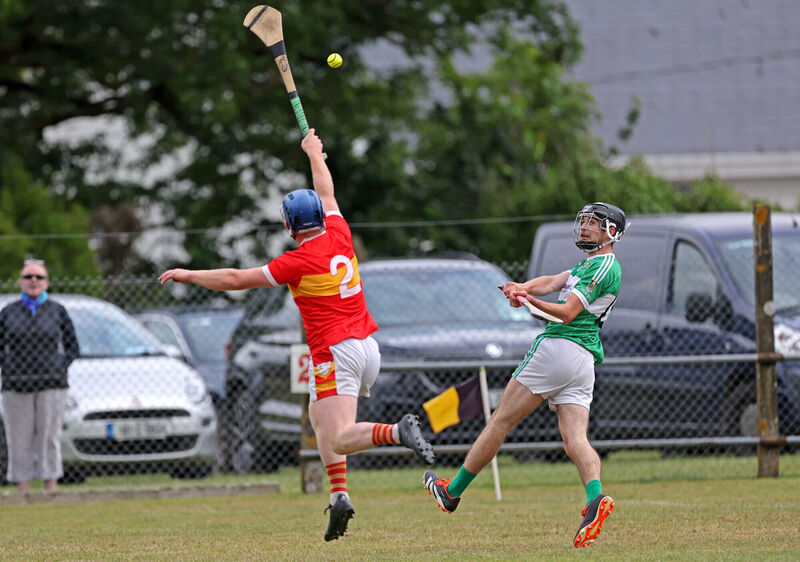 Brian Corcoran, Éire Óg, cannot stop the shot of James Lane, Aghabullogue. Picture: Jim Coughlan.