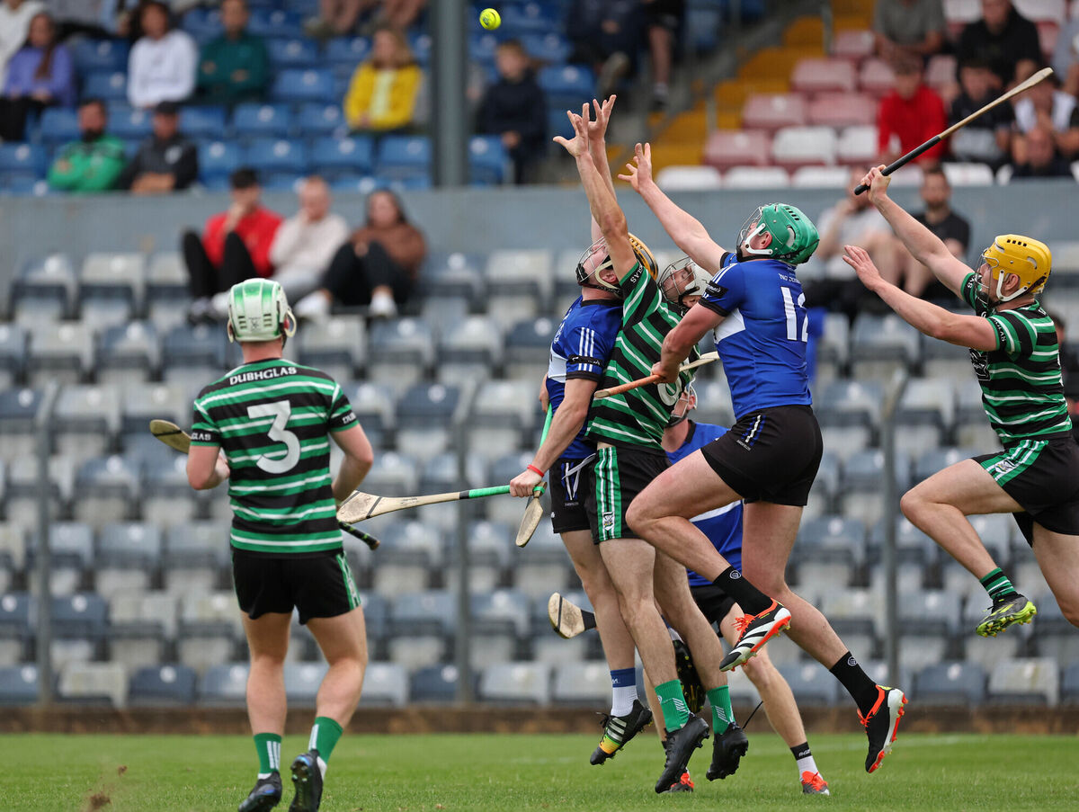  Daniel Hogan and James Sweeney of Sarsfields battle for the high ball against Douglas's Daniel Harte and Mark Howell. Picture: Jim Coughlan