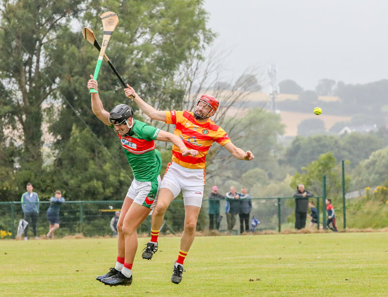 Kevin O'Sullivan of Fr O'Neill's and Newcestown's Tadhg Twomey contest possession. Picture: David Creedon Kevin O'Sullivan of Fr O'Neill's and Newcestown's Tadhg Twomey contest possession. Picture: David Creedon