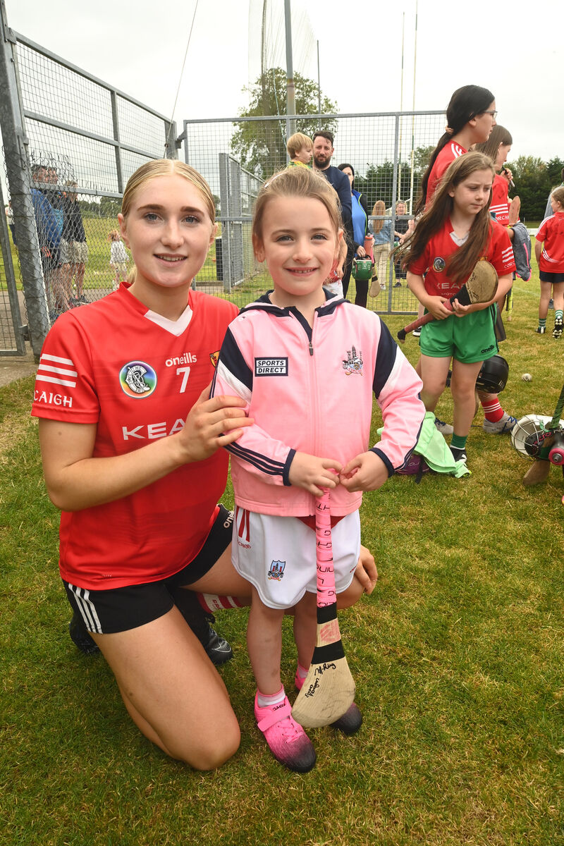 Meadhbh Ring with young fan Caragh MacSweeney at Aghabullogue GAA Club at Coachford, during the meet and greet session with the Cork intermediate camogie team on Saturday August 3.rd 2024. Pic Larry Cummins