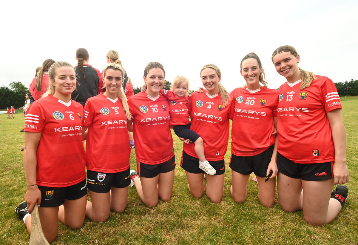  2yo Lauren McCarthy wearing a no 4 jersey to match her aunt, Emma Flanagan with (from left) Olivia McAllen, Laura Doyle, Tara McCarthy, Emma Flanagan, Avril Cashman and Hannah O'leary at Aghabullogue GAA Club at Coachford, during the meet and greet session with the Cork intermediate camogie team on Saturday August 3.rd 2024. Pic Larry Cummins