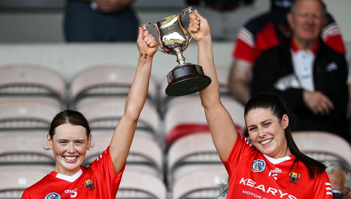 Cork joint captains Meabh Cahalane, left, and Molly Lynch lift the cup after the Munster Senior Camogie Championship final match between Cork and Waterford in Thurles. Photo by Brendan Moran/Sportsfile