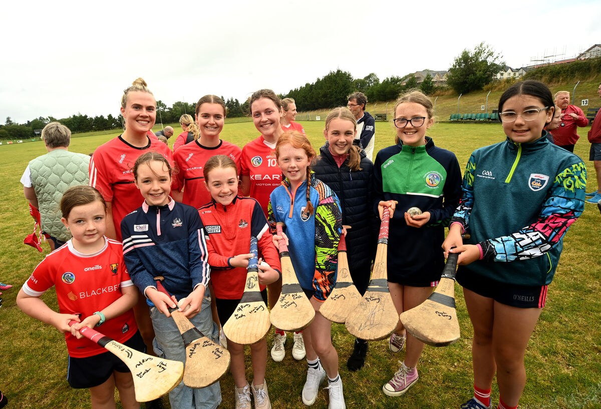  Cork Intermediate camogie players Lucy Allen (Sars), Niamh O'Leary (Brian Dillons) and Tara McCarthy (Glen Rovers) were busy signing hurleys for young players at Aghabullogue GAA Club at Coachford, during the meet and greet session with the Cork intermediate camogie team