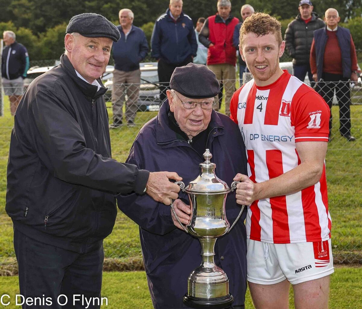 Colman and Michael Abernethy present the Abernethy Cup to Imokilly captain Ciaran O'Brien. Picture: Denis O'Flynn