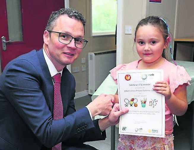 Minister Patrick O’Donovan with Saoirse O’Connor, after receiving her Summer Camp certificate. Picture: Jim Coughlan
Minister Patrick O’Donovan with Saoirse O’Connor, after receiving her Summer Camp certificate. Picture: Jim Coughlan