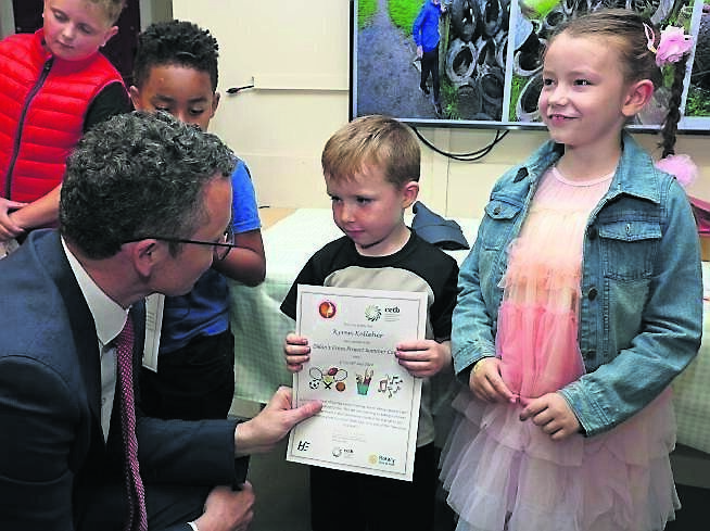 Minister O’Donovan, speaking with Kyren Kelleher, after receiving his Summer Camp certificate, also included is Kyren’s sister Ava. Picture: Jim Coughlan
Minister O’Donovan, speaking with Kyren Kelleher, after receiving his Summer Camp certificate, also included is Kyren’s sister Ava. Picture: Jim Coughlan