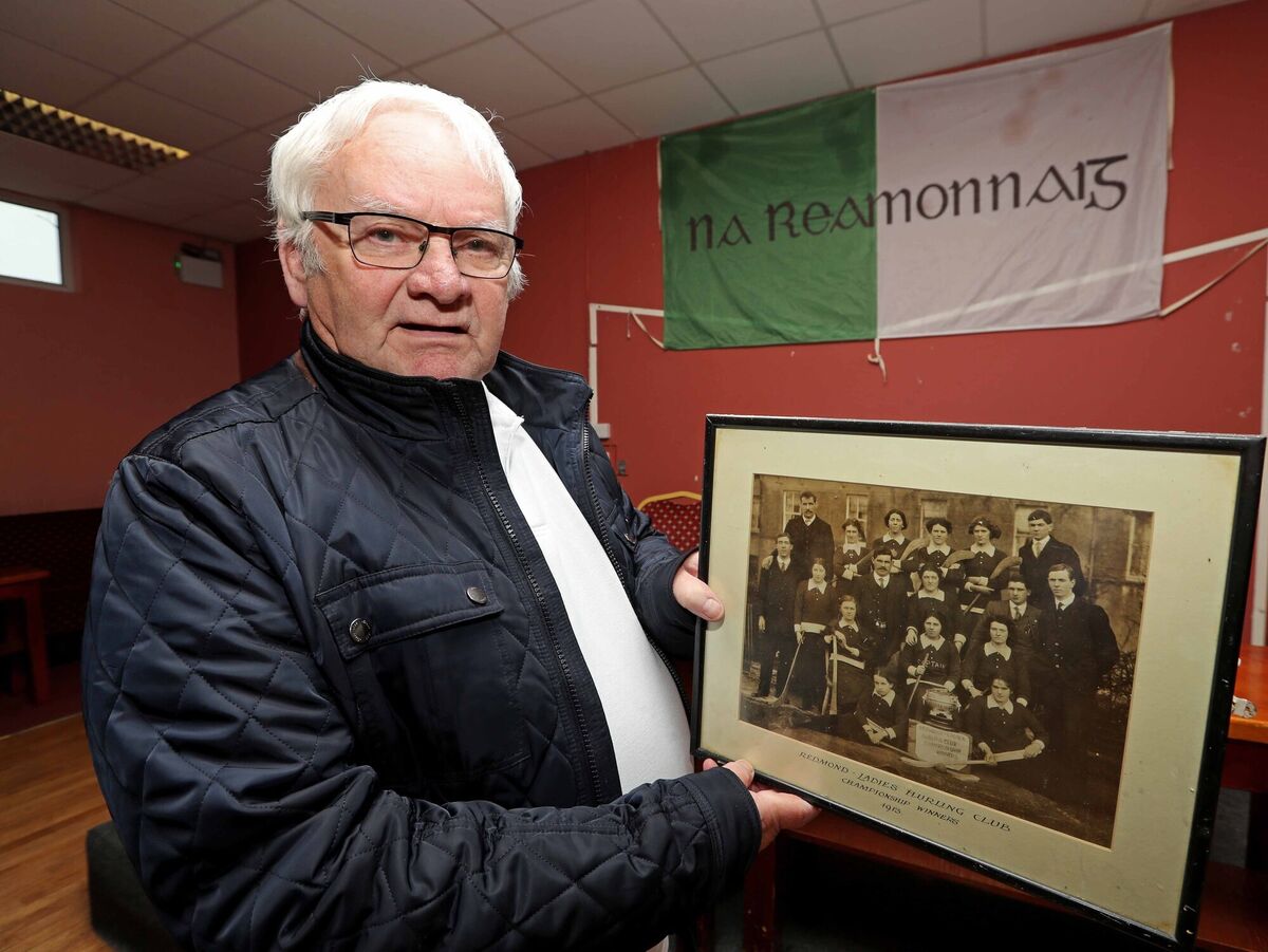 Redmonds GAA Chairman, Mick O'Shea, with a pictured dated 1913. Redmonds GAA Chairman, Mick O'Shea, with a pictured dated 1913.