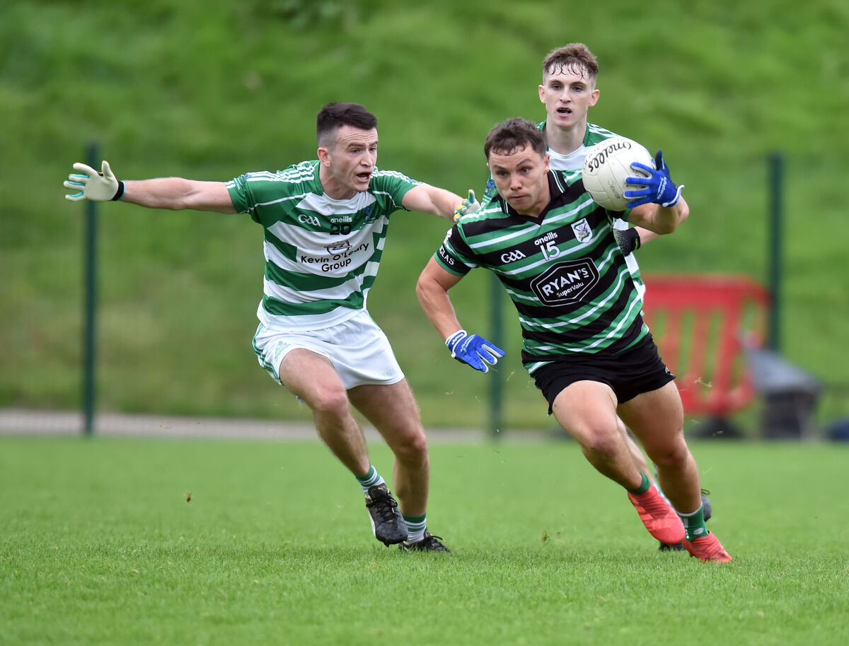 Douglas' Seán Powter breaks from Valley Rovers' Aaron Lyons at Ovens in 2020. Picture: Eddie O'Hare
