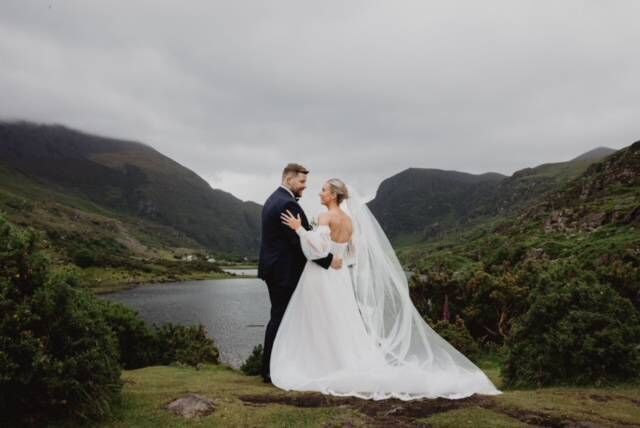 The stunning view over The Gap of Dunloe where the couple stood for photographs. The bride had to borrow hiking shoes from her photographer to ensure they got the perfect shot, at the right location.