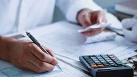 Man hand filling US tax form. tax form us business income office Financial document. Tax time.Tax concept. Close-up.