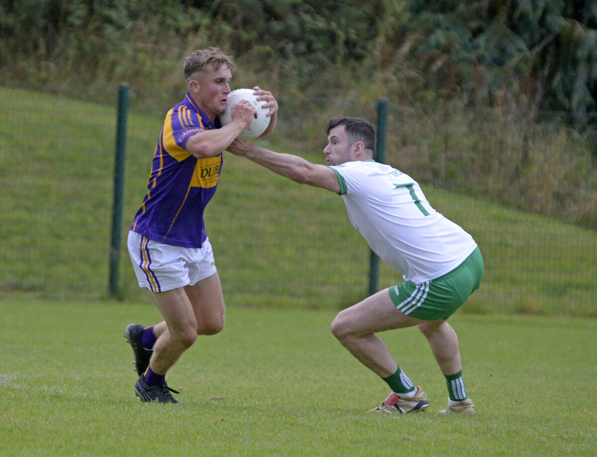 Keith O'Driscoll of Carbery tries to get past Muskerry's Kevin Manning in the McCarthy Insurance Group Premier SFC Divisions/Colleges semi-final in Ovens. Picture: Denis Boyle