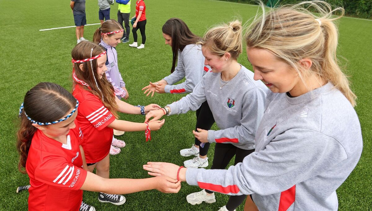 Megan Buckley, Laura O'Sullivan and Holly Donnacliffe, all Sarsfields Camogie, present Friendship Bracelets to Molly Lynch, Sarsfields Camogie &amp; Cork senior camogie captain, Clare and Orlaith Mullins, both Sarsfields camogie &amp; Cork senior camogie players. Picture: Jim Coughlan.