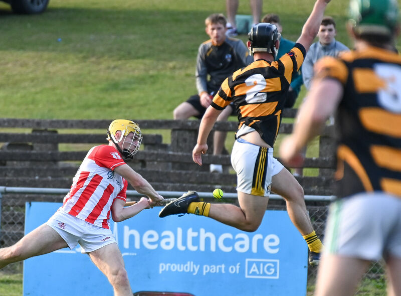  Avondhu's Fionnán Hickey flies high in an attempt to block the shot of Imokilly's Seán Desmond at Fermoy. Picture: David Keane