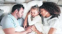 Top view, family and parents with child in bed for bonding, healthy relationship and sleeping at home. Morning, love and above o