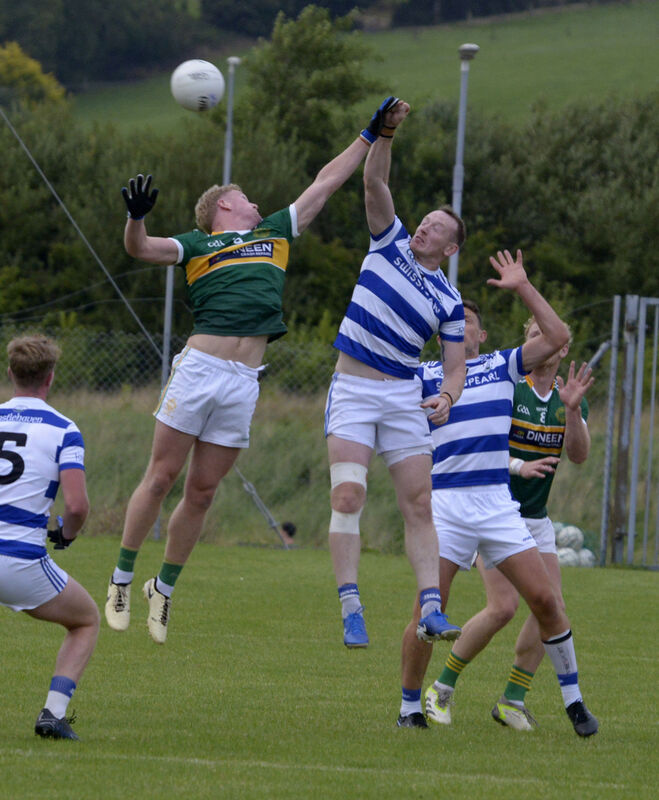 St Michael's Rory O'Shaugnessy and Castlehaven's Damien Cahalane jump for the ball. Picture: Denis Boyle