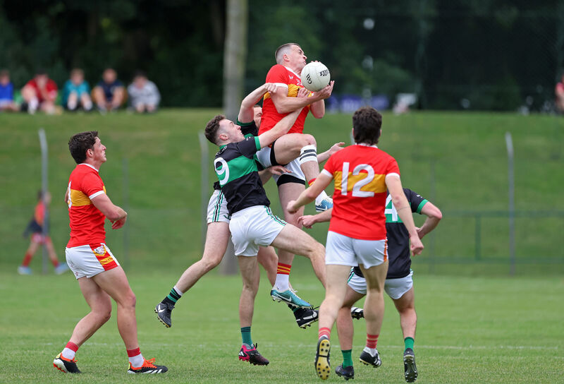  Alan O'Donovan and Barry Cripps of Nemo Rangers, battle for the high ball with Donnacha Kelly of Éire Óg. Picture: Jim Coughlan