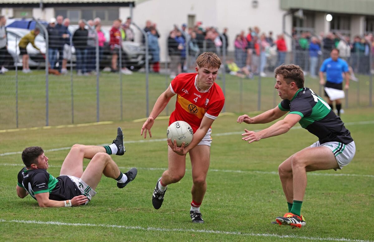 Colm Clifford of Éire Óg tries to evade Nemo Rangers pair Mark Cronin and Ross Corkery. Picture: Jim Coughlan
