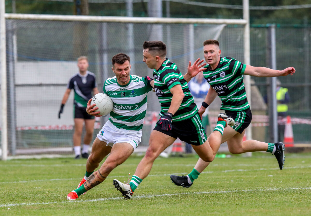 Valley Rovers' Fiachra Lynch under pressure from Douglas' Sean Powter. Picture: David Creedon