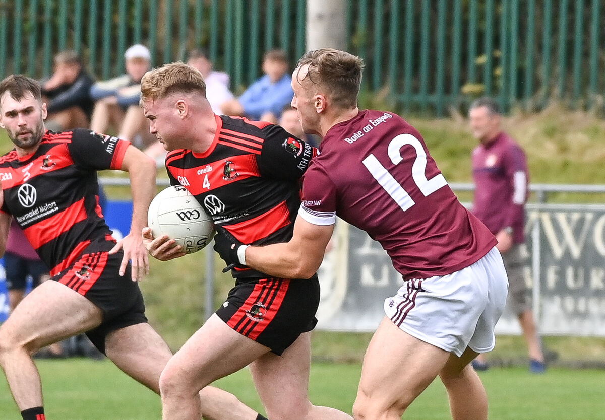 Newmarket's Mikey Browne is tackled by Bishopstown's Michael Nunan. Picture: David Keane. Newmarket's Mikey Browne is tackled by Bishopstown's Michael Nunan. Picture: David Keane.