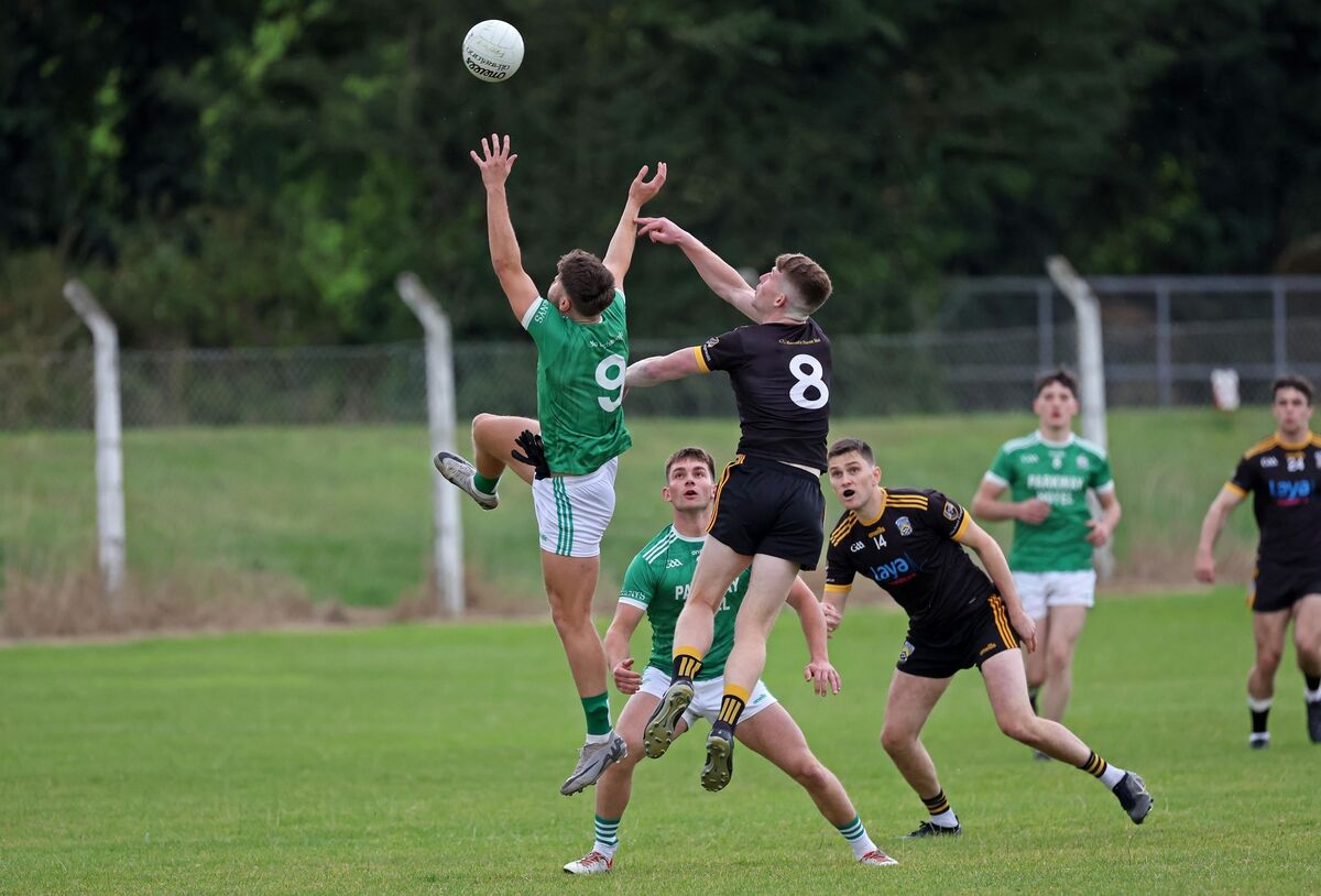 Dohenys' Rhys Coakley jumps for the ball with James O'Brien of Fermoy. Picture: Jim Coughlan