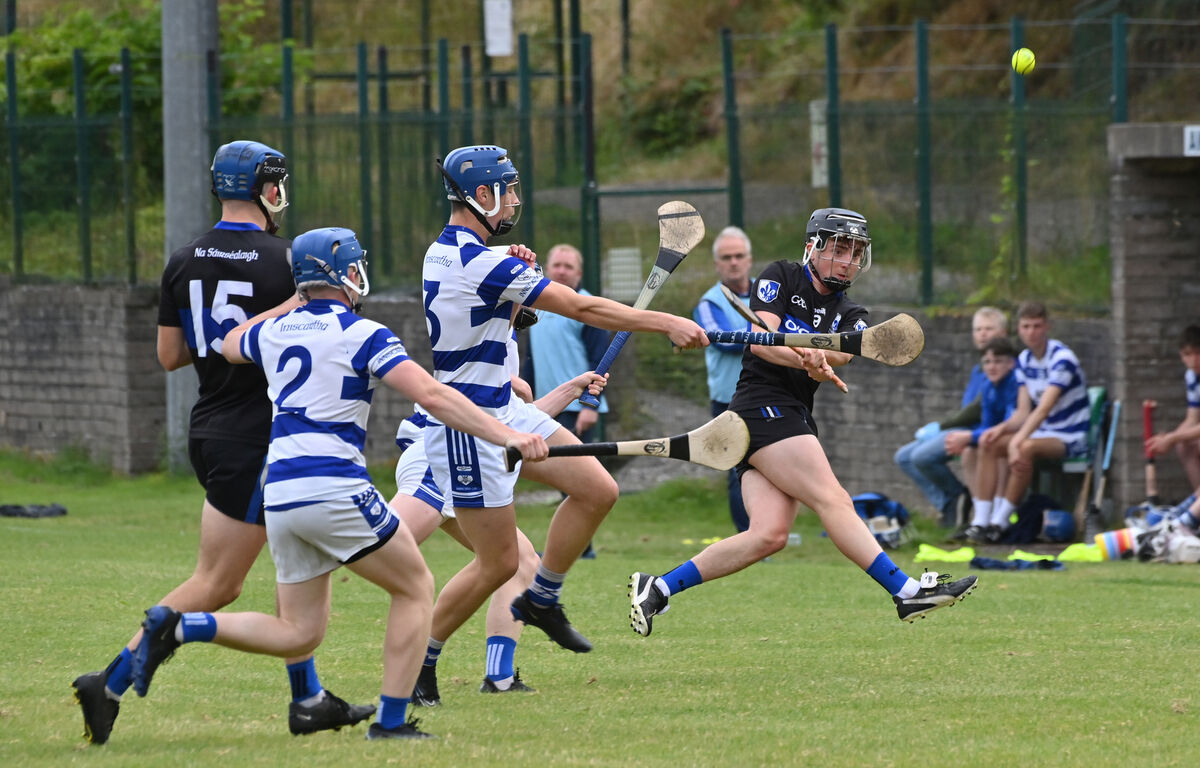 Sars' Cullen Condon getting in a shot on goal watched by Inniscarra players Conor O'Sullivan and Colm Herlihy. Picture: Dan Linehan
