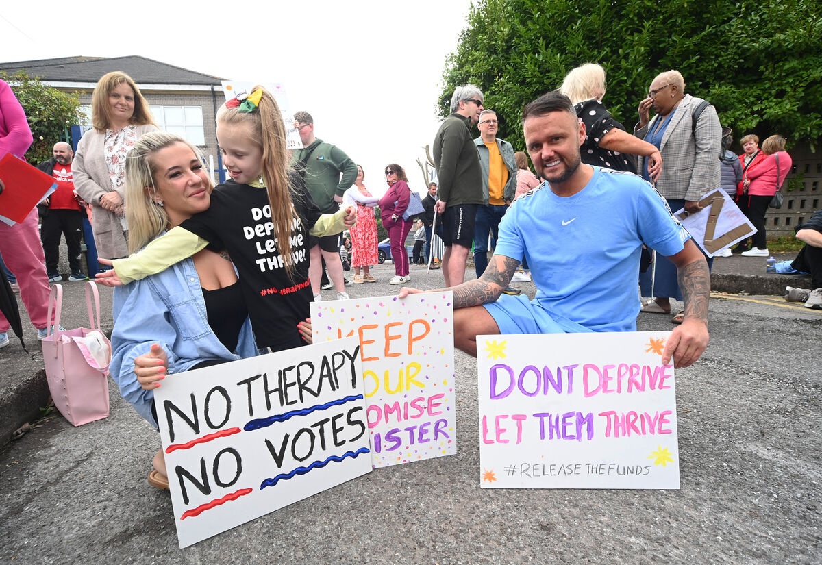  Parents Nicola Rice and Eric Morrison with their daughter Lexie at the protest at St Killian's School, Mayfield. Picture: Picture: Larry Cummins. 
