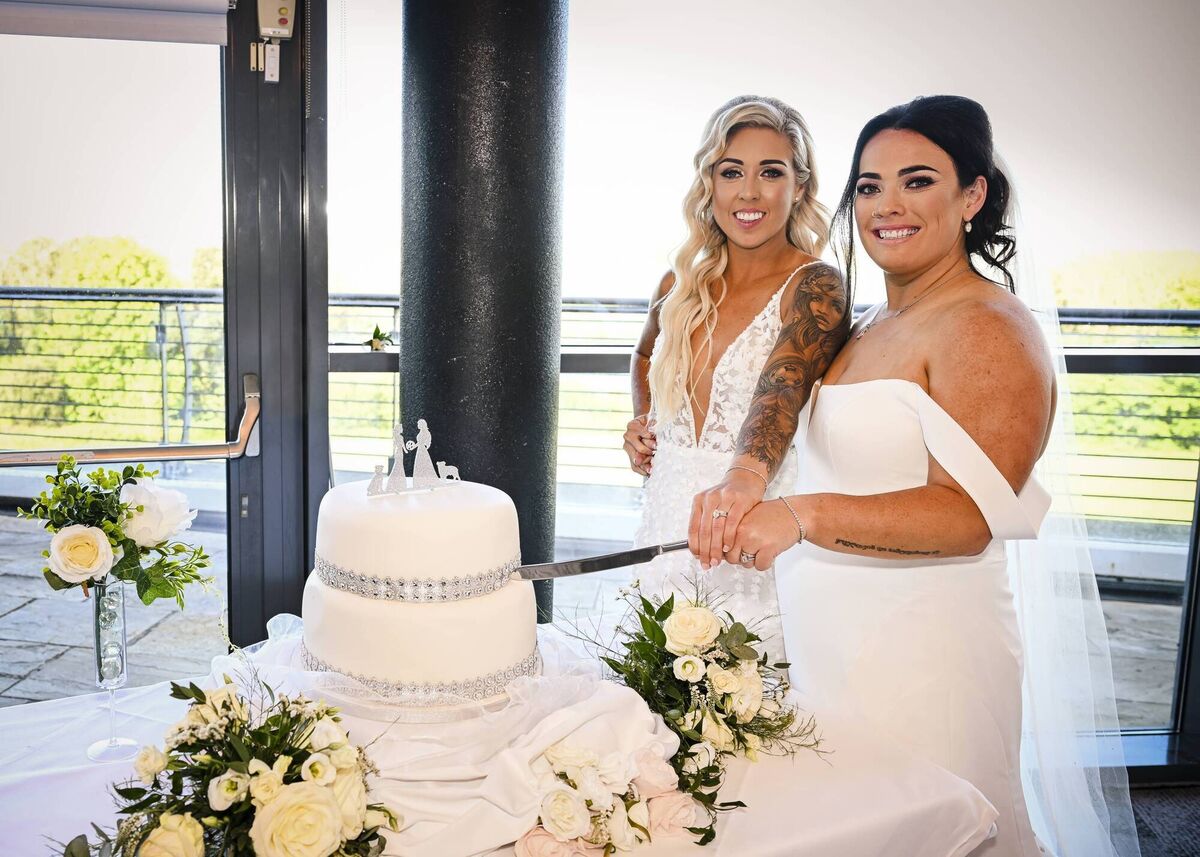 The happy couple cutting the cake.