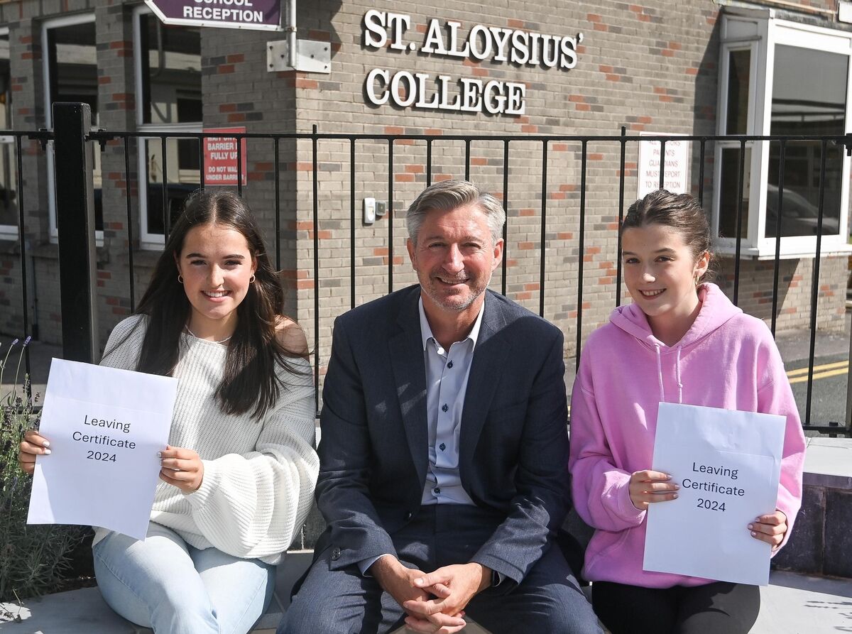  Chloe Collins and Laura Hilliard, are thrilled after receiving 625 points in their Leaving Cert, at St Aloysius' College, Carrigtwohill. Also included is college principal Sean Twomey. Picture: David Keane.
