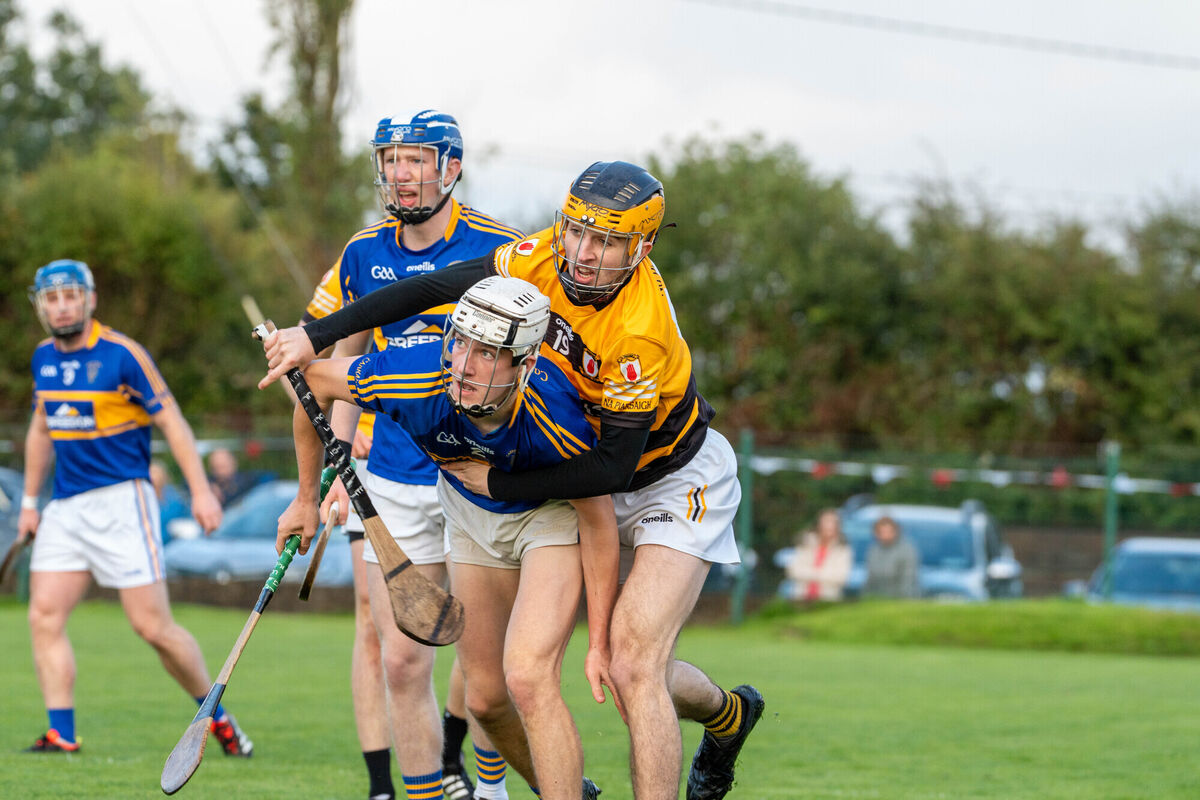 Na Piarsaigh's Padraig Guest holds back Adam Rooney, Carrigtwohill. Picture: Noel Sweeney