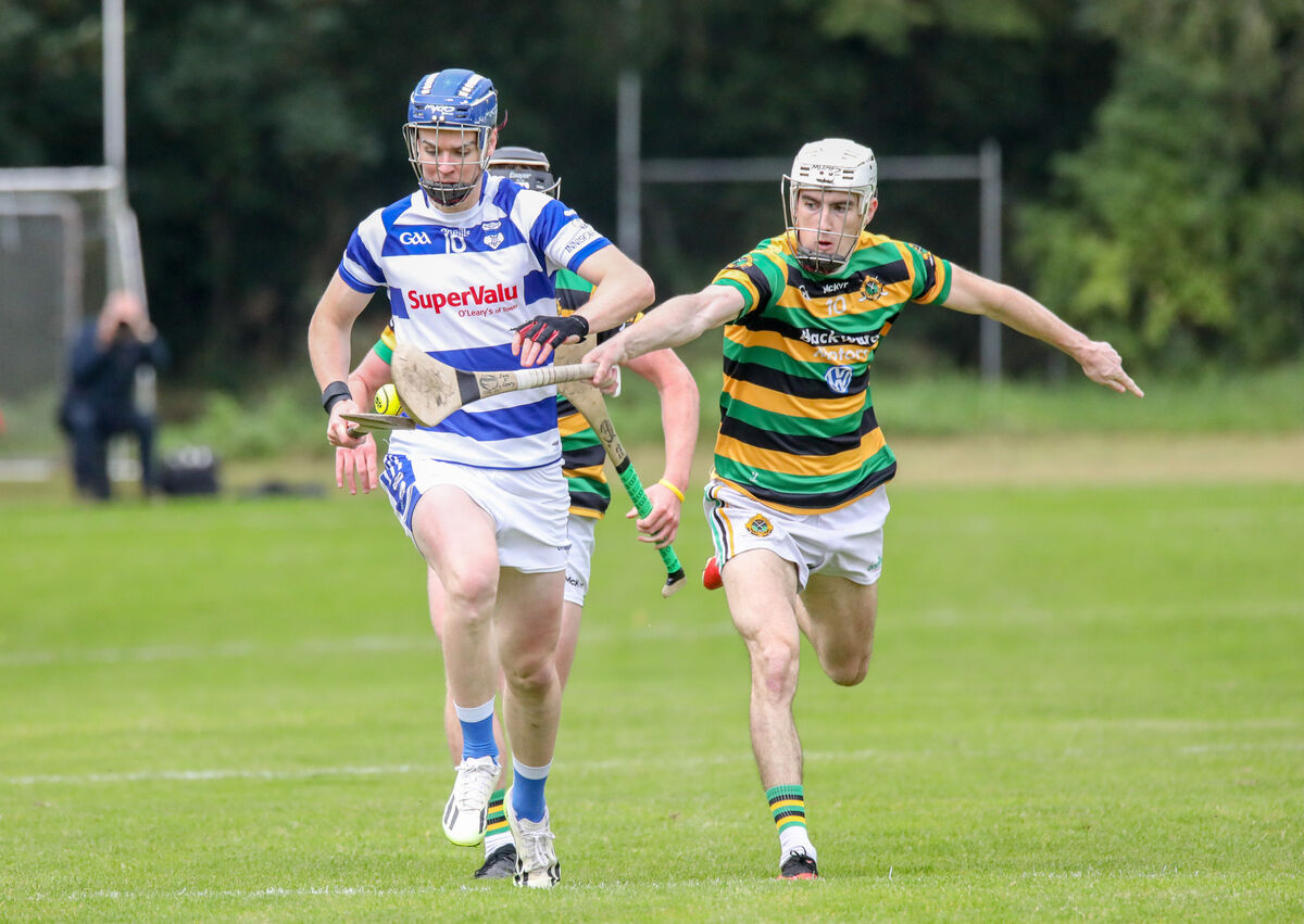 Innisarra's Andrew McCarthy is tackled by the Glen's Eoin O'Leary. Picture: David Creedon