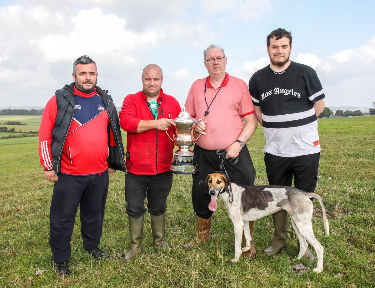 Damian Wade presents the senior trophy to Donal O'Donovan and his dog High Miss, with Mark Lynch, Donal O'Donovan and Jamie Wyse. Picture: David Creedon