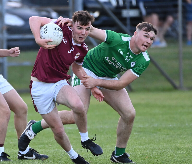 Bishopstown's Charlie Vaughan is tackled by Ballincollig's Charlie Murphy. Picture: Eddie O'Hare