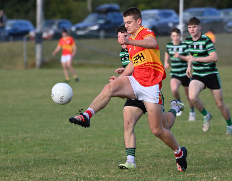 Éire Óg's Kevin Beechinor shoots from Douglas' Olly Barry during the P1MFC at Ovens. Picture: Eddie O'Hare