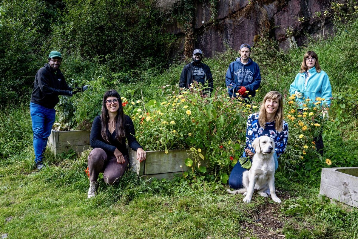 Carla Pittam founder of St Luke's Community Garden pictured with the volunteers, Omo Osax, Rasheed Atanda, Joe Lyons, Donna O’Sullivan, Barbara Falke and Fia the dog who help maintain the reclaimed green. Picture Chani Anderson Carla Pittam founder of St Luke's Community Garden pictured with the volunteers, Omo Osax, Rasheed Atanda, Joe Lyons, Donna O’Sullivan, Barbara Falke and Fia the dog who help maintain the reclaimed green. Picture Chani Anderson