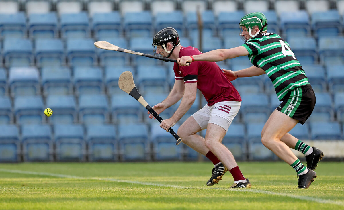  Kevin McSweeney, Douglas, battling Thomas Murray, Bishopstown, in Páirc Uí Rinn. Picture: Jim Coughlan.