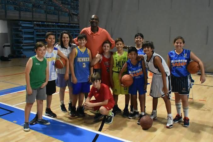 Ray Smith coaching some young players in his basketball academy in Malaga.