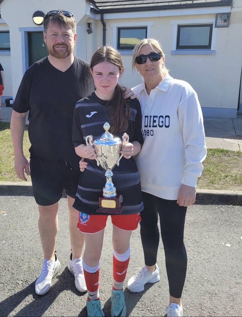  Stephen Walsh, his partner Alison and daughter Amy, who was part of the victorious All-Ireland winning Cork U12 squad.