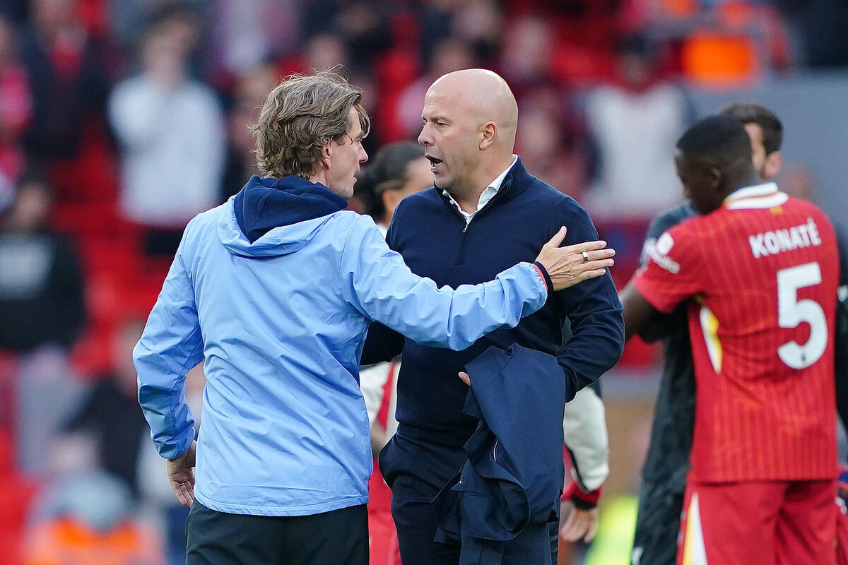 Liverpool manager Arne Slot embraces Brentford manager Thomas Frank (left) after the Premier League match at Anfield, Liverpool. Picture: Peter Byrne/PA Wire.