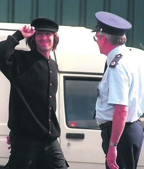 Liam Gallagher salutes the crowd on his arrival at Cork Airport for the 1996 concerts in Cork. Pic: Dan Linehan
                    