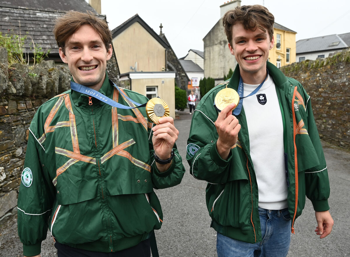 Irish Olympic rowers Paul O'Donovan and Fintan McCarthy, show off the gold to the town on Sunday. Picture: Eddie O'Hare