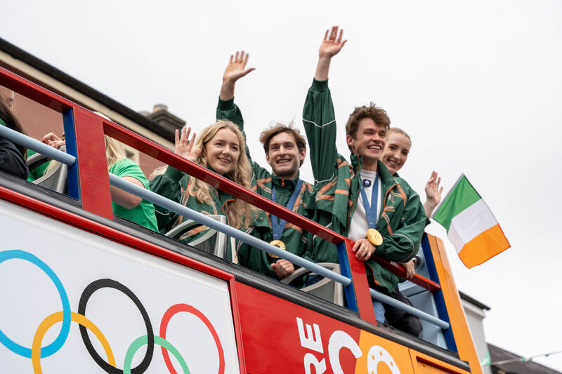 Aoife Casey, Paul O'Donovan, Fintan McCarthy and Emily Hegarty are paraded through Skibberene in an open top bus.  Picture: Noel Sweeney/PA Wire
