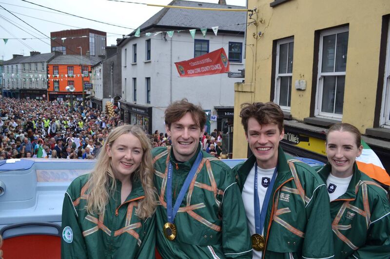 Skibbereen welcoming home its four Olympic rowing heroes, Aoife Casey, left,  and Emily Hegarty with gold medallists Paul O'Donovan and Fintan McCarthy during an open top bus parade through the West Cork town. Picture; Anne Minihane.