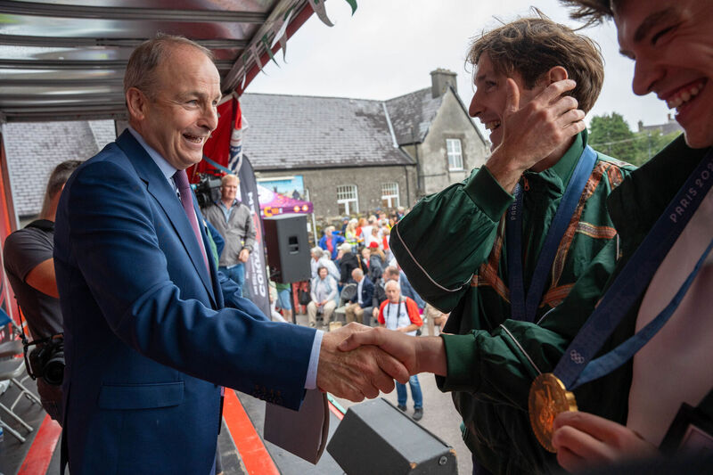 Tanaiste Micheal Martin with Paul O'Donovan and Fintan McCarthy during an homecoming celebrations. Pictue: Noel Sweeney/PA Wire