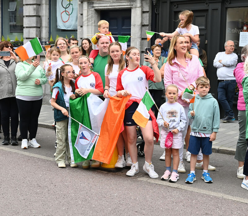  Here they come! Watching the Olympic homecoming.   Picture: Eddie O'Hare